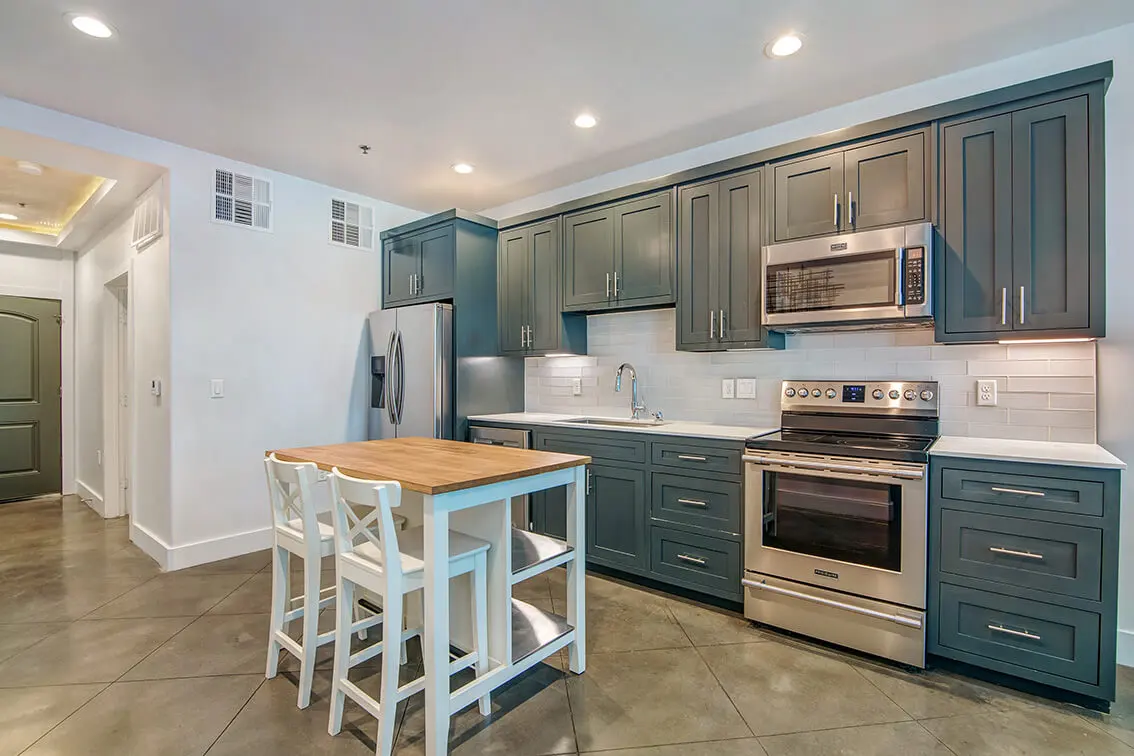 404 Industrial Park kitchen with blue gray shaker cabinets and stainless steel appliances (11)